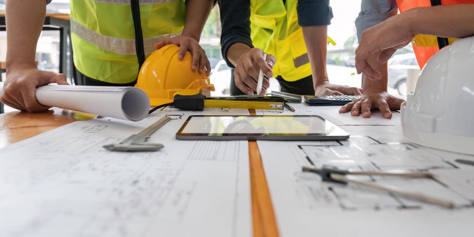Engineering consultant discussing composite design notes with a project team